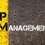 Concept image of Business Acronym PM as PROJECT MANAGEMENT written over road marking yellow paint line.