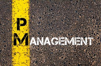 Concept image of Business Acronym PM as PROJECT MANAGEMENT written over road marking yellow paint line.